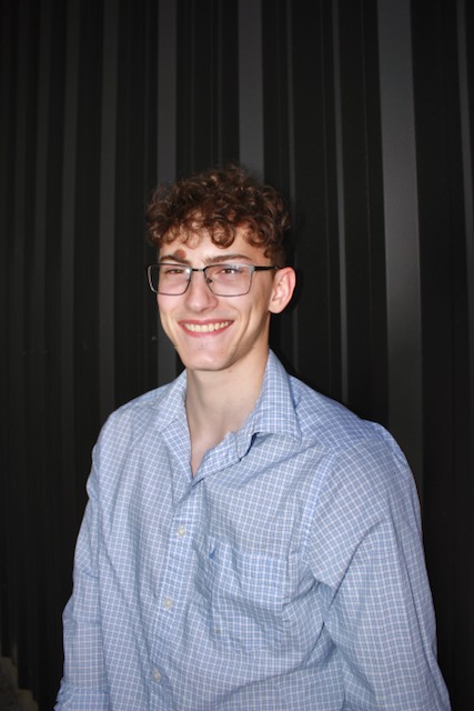 Headshot of Heath, the owner